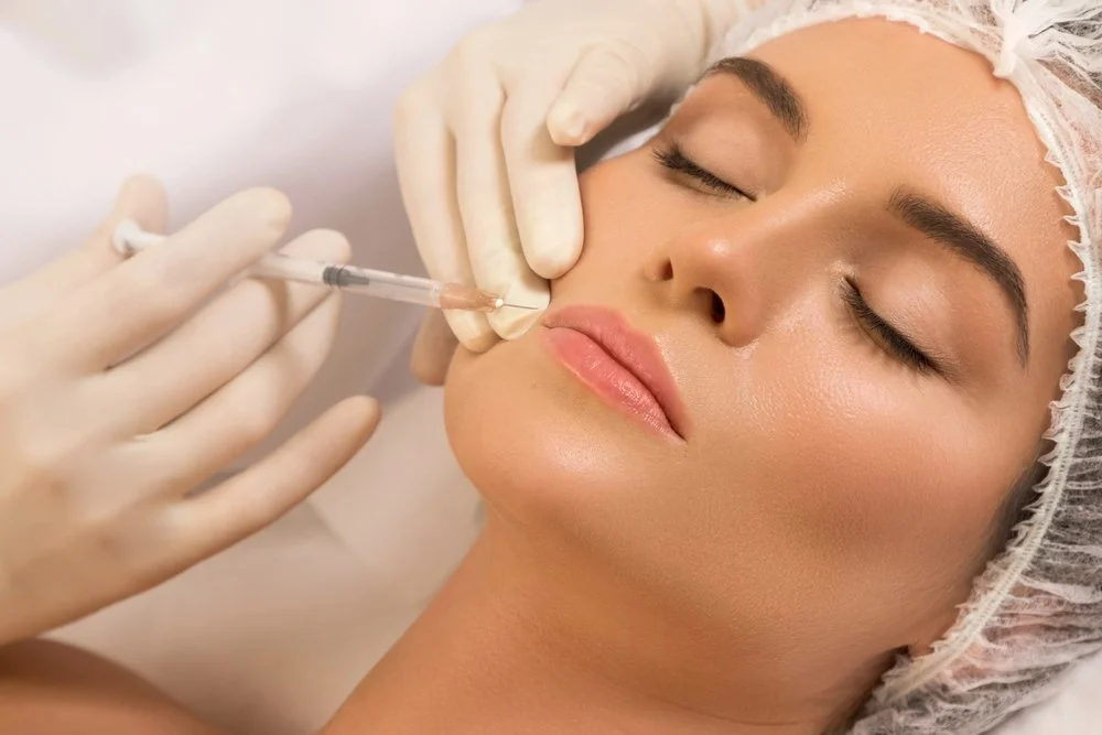 Skincare specialist performing precise microneedling with focused technique and sterile professional tools